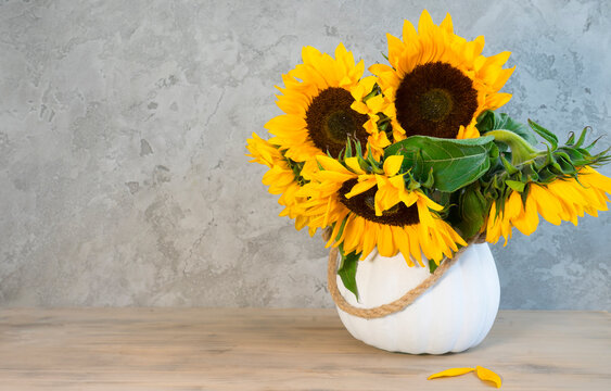 Bouquet of sunflowers in a white vase