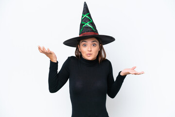 Young caucasian woman costume as witch isolated on white background having doubts while raising hands