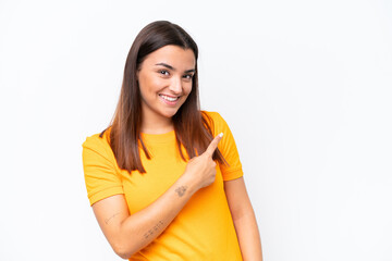 Young caucasian woman isolated on white background pointing to the side to present a product