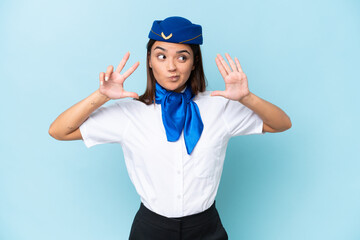 Airplane stewardess caucasian woman isolated on blue background counting eight with fingers