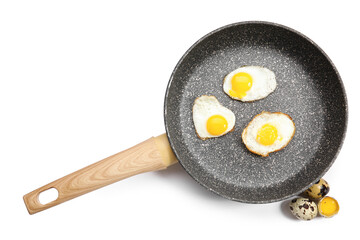 Frying pan with tasty fried quail eggs on white background