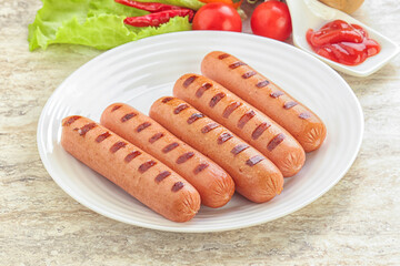 Grilled sausages with tomato sauce