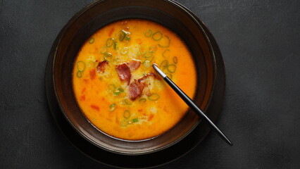 German Beer Cheese soup with the cheddar and fried bacon. Oktoberfest party concept