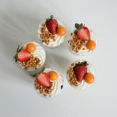 Delicious pastries in a cup with berries