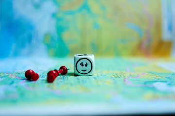 Map of the world with buttons and cube in close-up. Concept - planning.