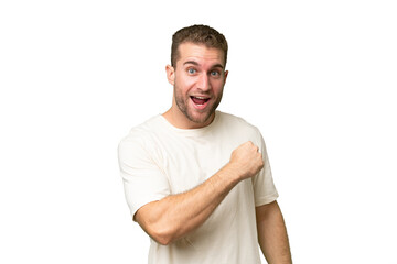 Young handsome blonde man over isolated background