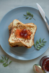 Toasted bread on a plate with jam