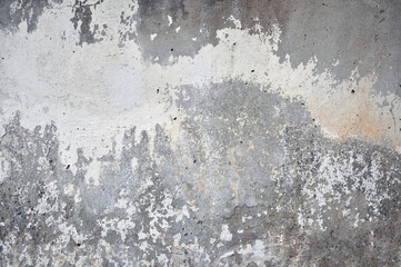Empty old plastered wall texture. Painted problematic wall surface. Dilapidated building facade with damaged plaster.