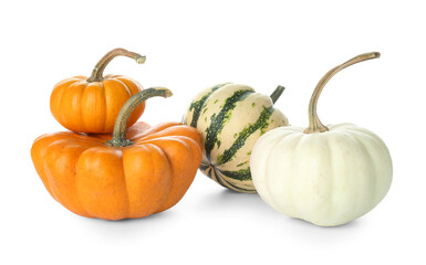 Heap of different Halloween pumpkins on white background