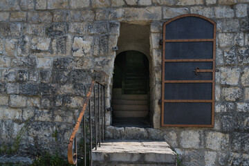 Metal door, entrance to the ancient tower of the fortress.