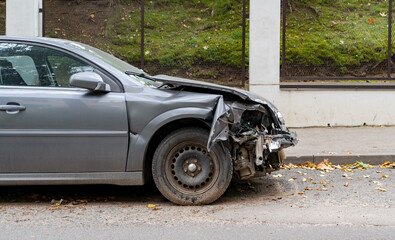 Crashed car in the accident on the city street.