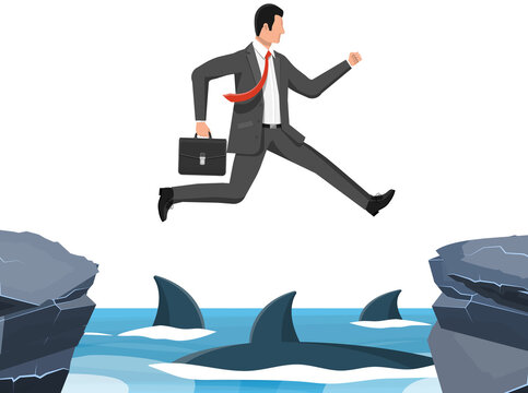 Businessman Jumping Over Shark In Water.