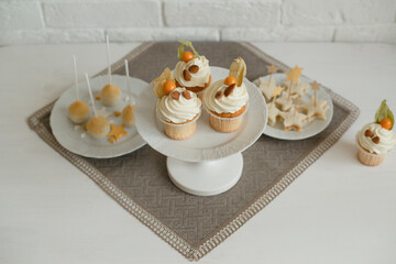 Baking cupcakes with almonds on the table