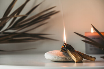 Palo Santo sticks on a light background.Aromatherapy religious rituals meditation.Wellness with...