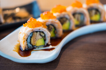 Philadelphia classic. Salmon, Philadelphia cheese, cucumber, avocado on top with tobiko and salmon caviar