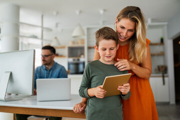 Distance learning, online education, home work concept. Family with digital devices at home.