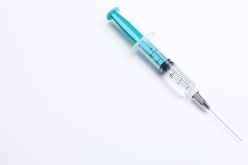 Medical syringe on a white background. A syringe for injection. The concept of health and beauty