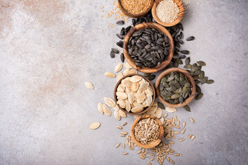 Bowls with different seeds as ingredient for oil and healthy meal