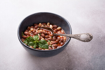 Bowl of vegetarian healthy meal with beans and tomato sauce