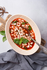 Bowl of vegetarian healthy meal with beans and tomato sauce