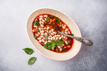 Bowl of vegetarian healthy meal with beans and tomato sauce