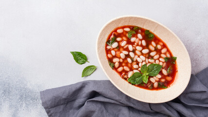 Bowl of vegetarian healthy meal with beans and tomato sauce