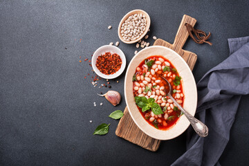 Bowl of vegetarian healthy meal with beans and tomato sauce