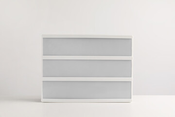 Blank letter board on white table. Mockup for design