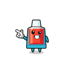 toothpaste mascot pointing top left