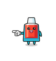 toothpaste cartoon with pointing left gesture