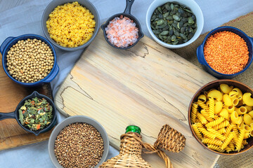 Different vegetarian organic products in bowls. Rural view. Top view. Copy space.