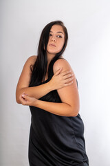 Woman posing on isolated white background, selective focus shot.