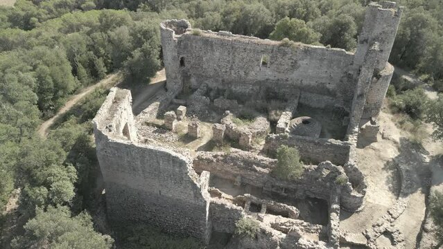 Aerial images of the ruined castle of Iscle on the Costa Brava of Girona Aerial view with flat colors Log