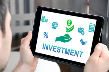 Fototapeta na wymiar Investment concept on a tablet