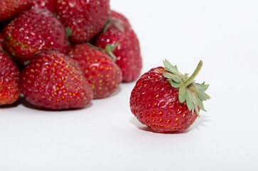 Strawberries on a white background. Strawberry close-up isolated. Juicy berries picked for dessert.