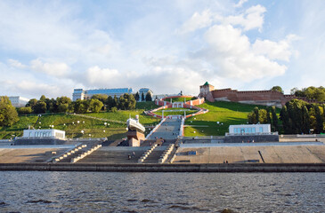 Tourists walk in the summer evening on the Chkalovskaya stairs