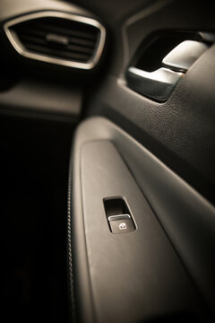 Window lifter button in car door