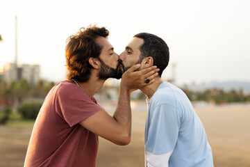 Happy couple enjoy outside. Gay couple embracing and showing their love.