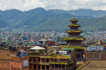 Fototapeta na wymiar Bhaktapur, Nepal - Top view of Nyatapola Temple with mountains and city