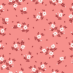Vintage floral pattern with small white flowers on a pink background. Seamless pattern for design and fashion prints.Stock vector illustration.