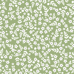 Floral pattern with small white flowers and leaves on green background. Seamless pattern for design and fashion prints.Stock vector illustration.
