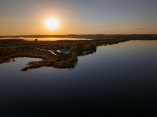 Sunset over Lake Maibalyk in Burabai National Park. Cloudless sky.  Aerial top view.