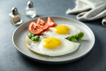 Roasted eggs with tomatoes and basil