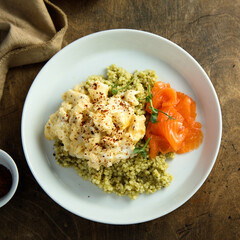 Scrambled eggs with couscous and smoked salmon
