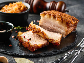 Roasted pork belly. Crispy Roast Pork Belly with stewed cabbage and spices. CLose-up - 532709931
