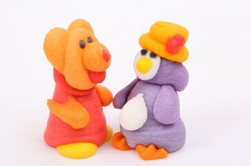 Doll made of colored sugar isolated on white