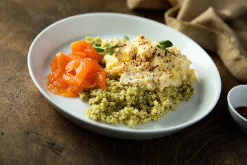 Scrambled eggs with couscous and smoked salmon
