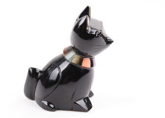 Statuette of a black cat isolated on a white background