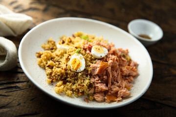 Pilau with salmon and quail eggs