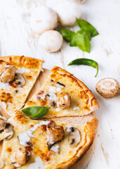 Tasty fresh baked pizza with champignons and chicken fillet